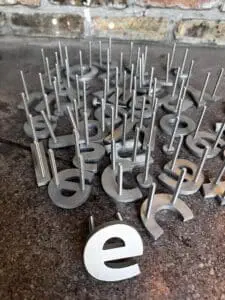 screw studs on signs installation